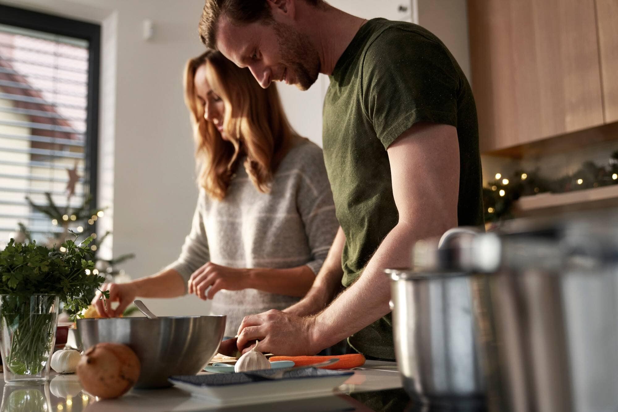 Stefan and Christina cooking together in their kitchen