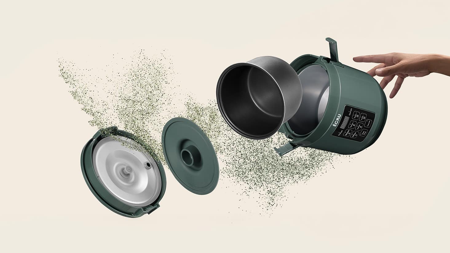 ÉCRU decarboxylator exploded in mid-air over scattered dried herb, a hand reaching for the shell