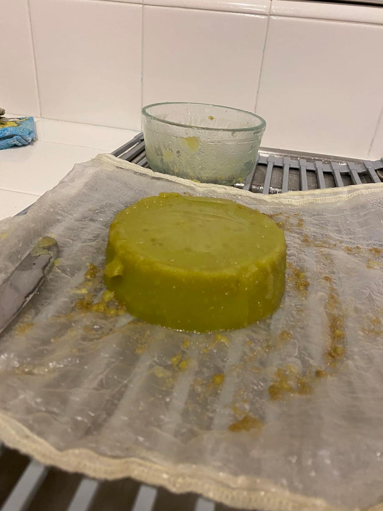 Customer photo: a puck of finished green butter cooling on cheesecloth