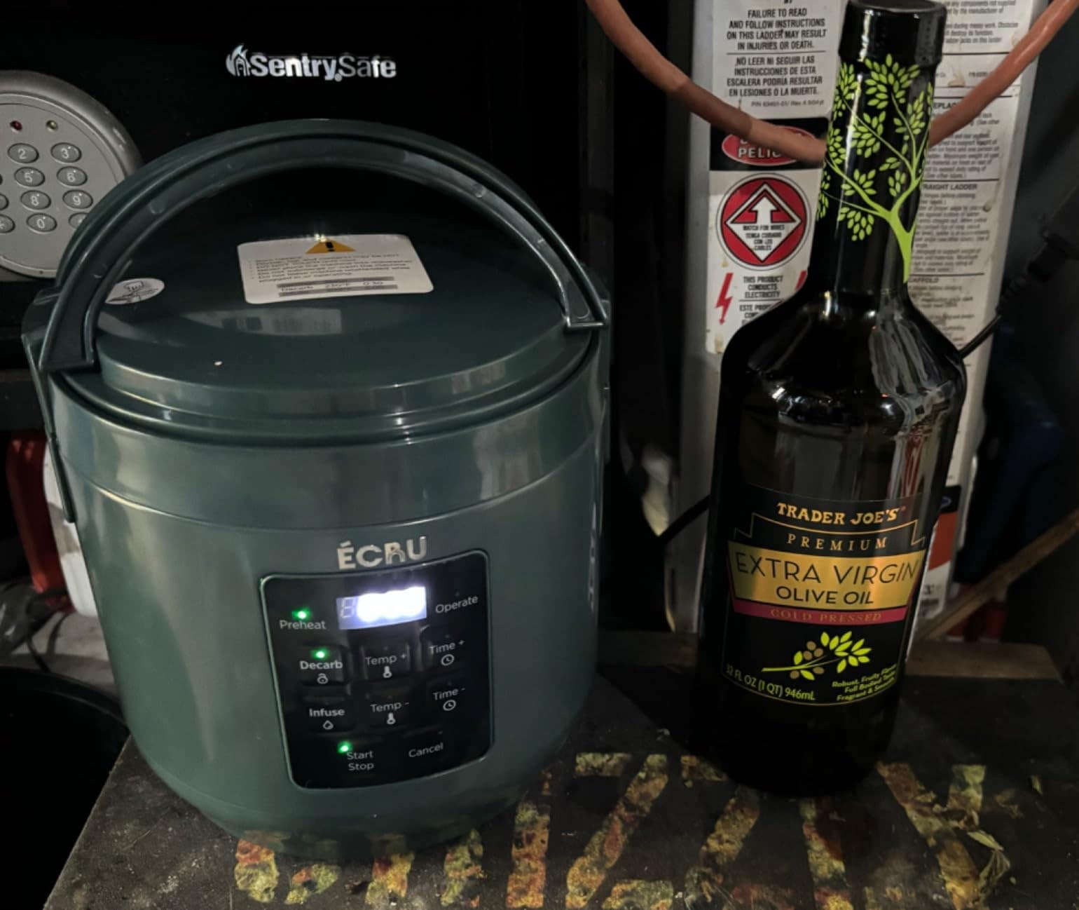 Customer photo: decarboxylator beside a bottle of finished infused olive oil